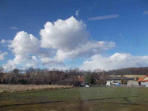 Clouds &amp; fields seen from a train - polish countryside - Lower Silesia, Poland.