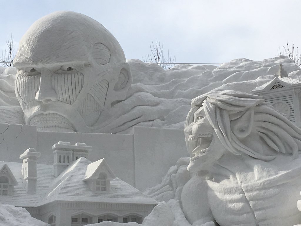 Close-ups of the Colossal Titan model and actual snow sculpture under construction,