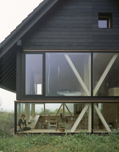 doeyzooey:  Zurich-based architect Pascal Flammer designed this timber house in Balsthal, Switzerland, which is sunken 2.46ft (75cm) with ground-level wrap around windows, connecting it with nature in a special, unique way.  Please….. I want it