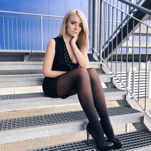 Natalia in black dress and black tights