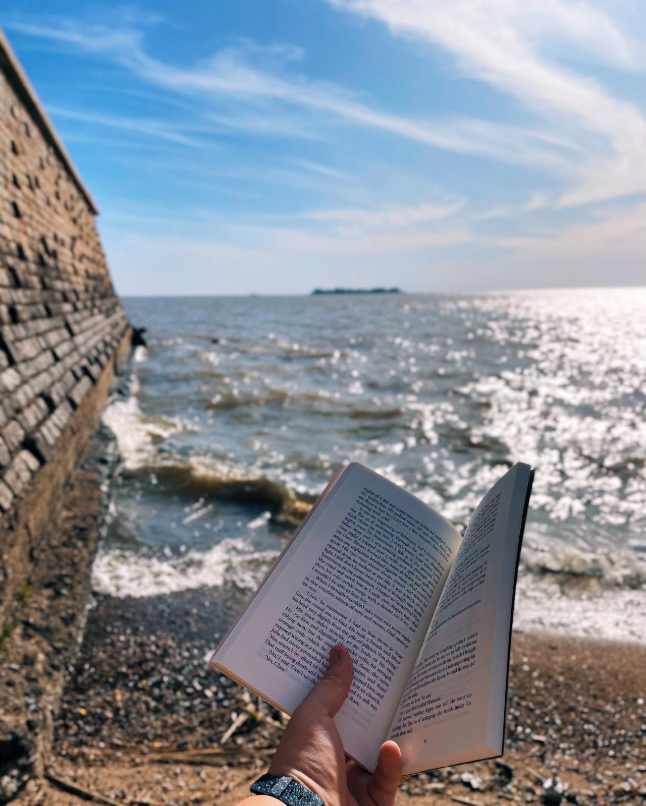 Reading and finding sea glass on the beautiful riverside of Colonia del Sacramento in Uruguay.