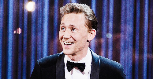  Tom Hiddleston onstage presenting the Best New Play Award at The Laurence Olivier