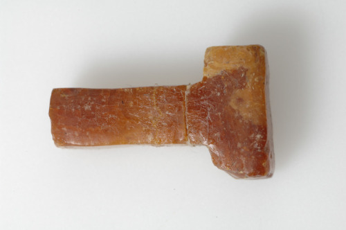 loki-freyjason:A small, unfinished amber pendant of Mjölnir, found on the island ofAdelsö (Uppland, 