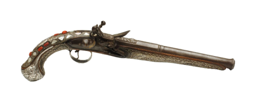 Turkish flintlock pistol decorated with silver, mother of pearl, and polished red coral. Early 19th 