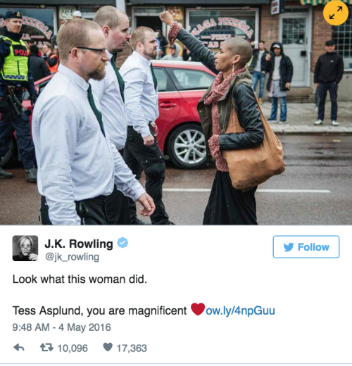 thefingerfuckingfemalefury:  nita-approved:  huffingtonpost:  Brave Black Woman Stands Alone Against Hundreds Of Neo-Nazis  I know I keep re blogging this and I will continue to whenever I see it.   Refusing to let these filthy nazi trash intimidate her
