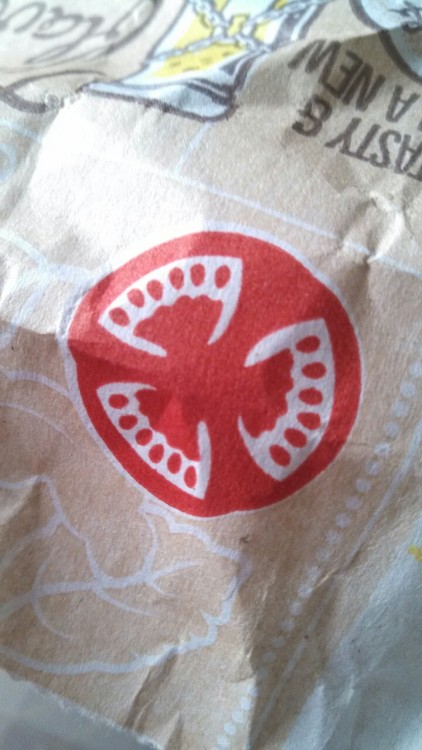 So, I know McDonalds intended for this to be a nice, fresh, cross section of a tomato, but it looks more like three sets of vampire teeth, like, McDonalds you’ve got like a vampire gang symbol on your takeout bags