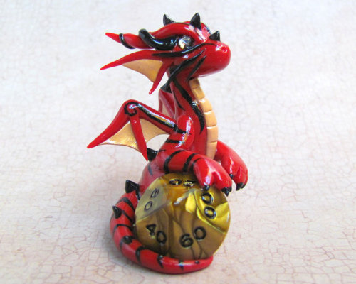 tomarou:  rosesakurax:  thatfilthyanimal:  ensorevolution:  Tiny Dragons That Take Care of Your Gaming Dice http://www.themarysue.com/dice-dragons-becca-golins/#0  [SCREAMS] I WANT THEM  Cuteee  I couldn’t resist reblogging; NO REGRETS 