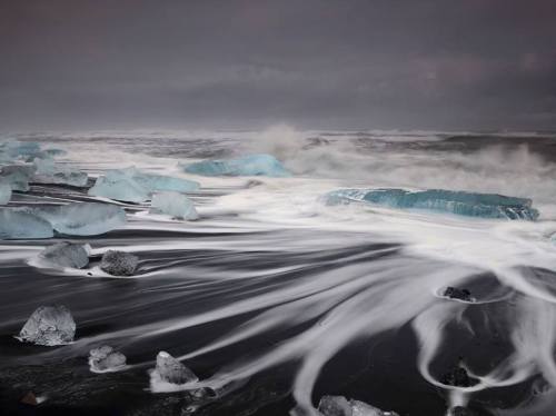 Waves over Jökulsárlón beach.Using a one second exposure, photographer Sophie Car