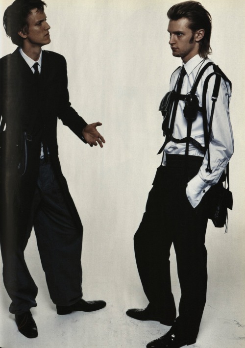 in-the-name-of-raf:  teenagedirtstache:  Workmates photos by Satoshi Saikusa April 2003 L’Uomo Vogue fashion editor Mika Mizutani Da sinistra coat di cotone, Raf Simons; shirt & tie, Dior Homme by Hedi Slimane; cargo pants, Voyage; cartella nera,