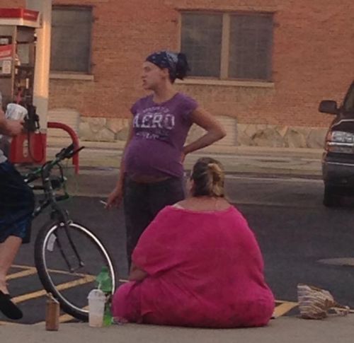 funnygurl1979:stunningpicture:I call this ‘Pregnant Woman Smoking at a Gas Station next to the Blob.