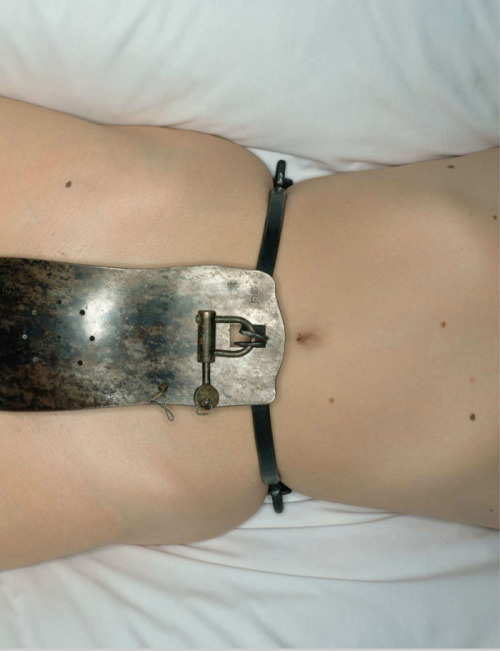 Veruschka wearing a medieval chastity belt (Irving Penn)