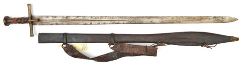 Sudanese Kaskara, 19th Century or Early 20th Century A Sudanese sword kaskara, blade 35”, with