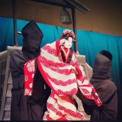 gaijinger:  Bunraku, traditional Japanese puppetry. Usually manned by three performers in black. They were masterful. I desperately want to take a class on it.  Those guys need to be in a survival horror game. Like two of them, with their overly long
