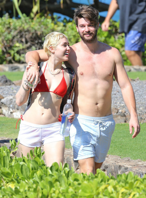 Miley Cyrus in red bikini with Patrick Schwarzenegger (click for more photos)