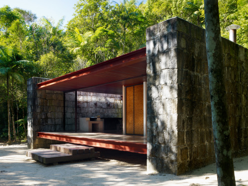 letsbuildahome-fr:  House in Rio Bonito by Carla Juaçaba Four steel beams puncture walls so as to allow a sliver of glazing to wash the interior of the stone walls with diffused light. The visual weight of the rustic stone counters the lightness of