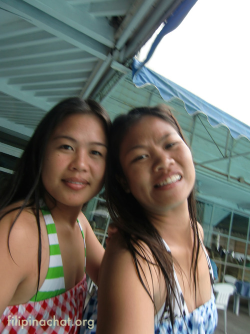 Two Pinays having fun on their day off while picknicking next to poolside at Clarkton Hotel.