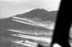 soldiers-of-war:  SOUTH VIETNAM. August 14, 1968. Flying 100 feet above the jungle hills west of Hue, five bulky C-123 “providers” cut loose a spray of chemical defoliant. The planes are flown by U.S. air force crews who have nicknamed themselves