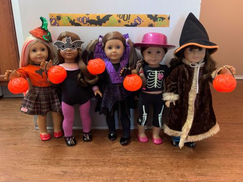 A Very Merry American Girl Halloween. Some of the dolls are wearing the same costumes from last year