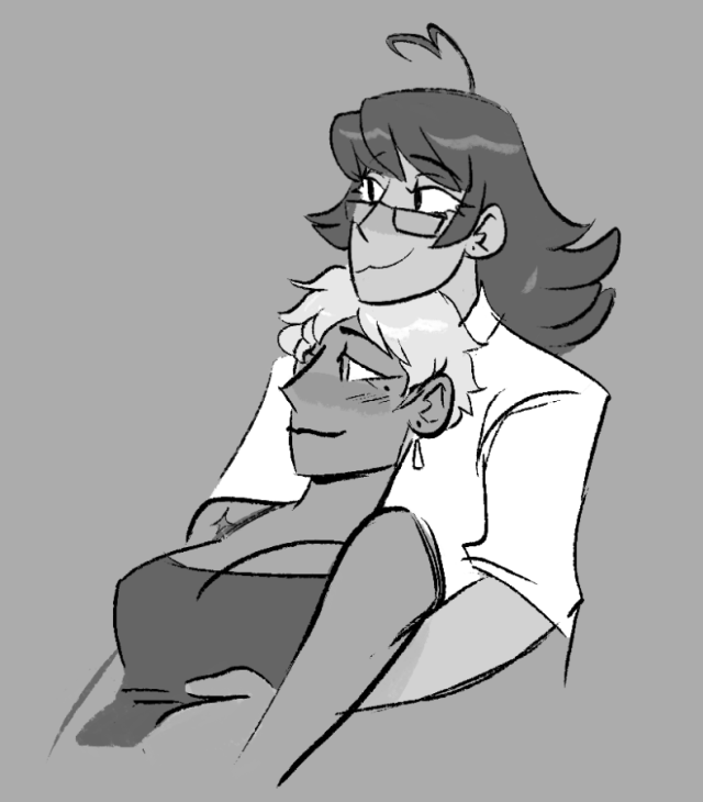 Franziska and Sebastian in casual/home clothes. Fran lays back on Seb's chest while they rest their head on top of hers.