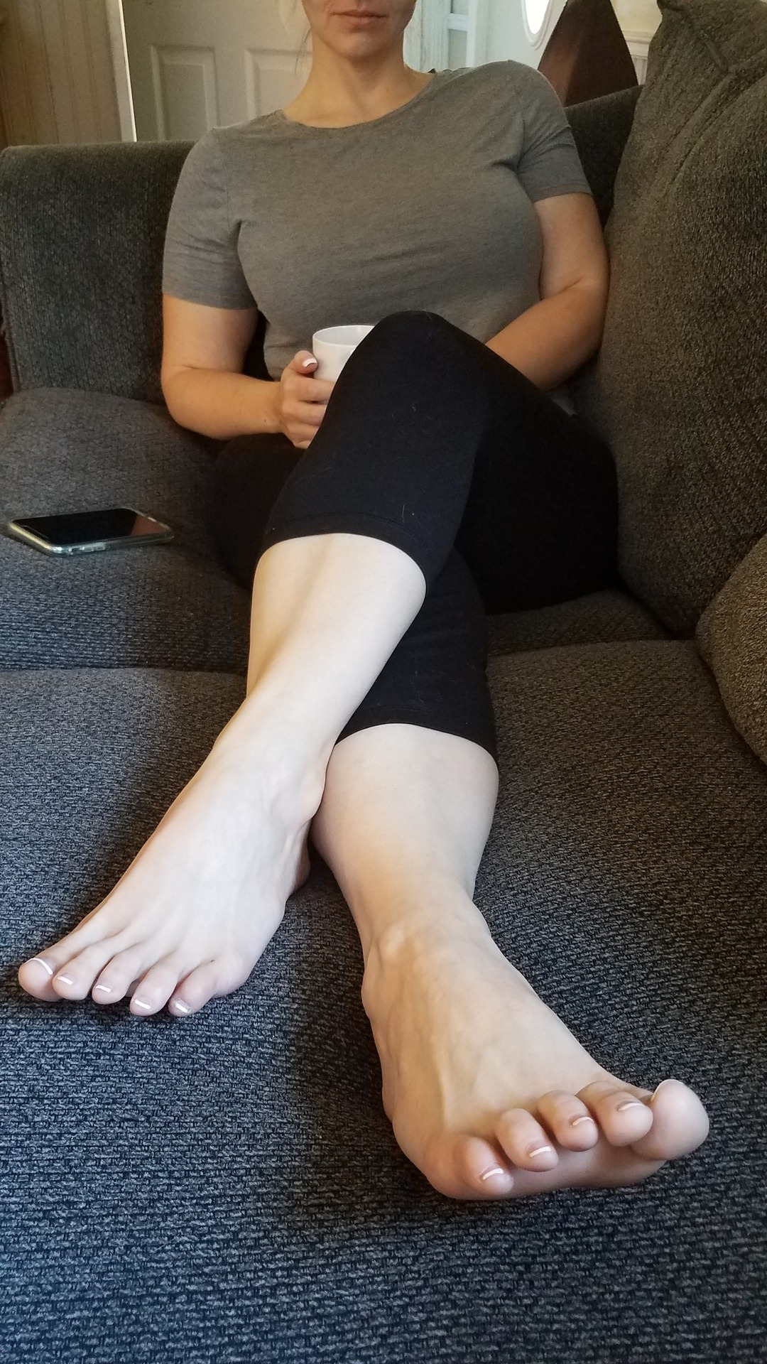 myprettywifesfeet:  My pretty wife looking cute on the couch with her morning coffee.please