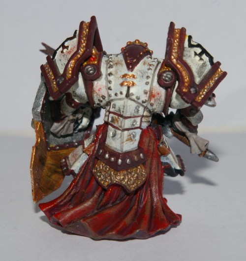 Number four, Pyotr Vadik Zolmow, has his roots in Khador, as his red cloak represents. He is a bulky