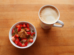 garden-of-vegan:  Oatmeal (cooked in water with ground flax seed) topped with chopped strawberries, pumpkin seeds, almond butter, brown sugar, and coconut milk. Coffee with vanilla soy milk. 