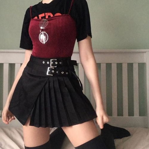 pleatedminiskirts: Wow! Extreme rock chick! She even has two belts!