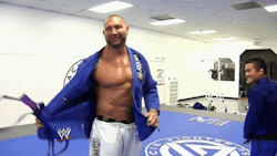 Batista being whipped during his Jiu-Jitsu