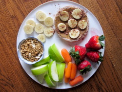 aspect-of-life:  Pita with sunflower seed butter, banana slices and cocoa; vanilla greek yogurt with granola; strawberries; carrots; and green apple slices 