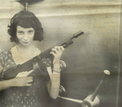 ircimages:  Madam Moll, gangster from the late 20s, with her M1928 Thompson in front of a bank safe she just robbed 