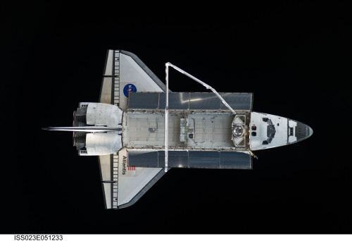 for-all-mankind:Space shuttle Atlantis is featured in this image photographed by an Expedition 23 cr