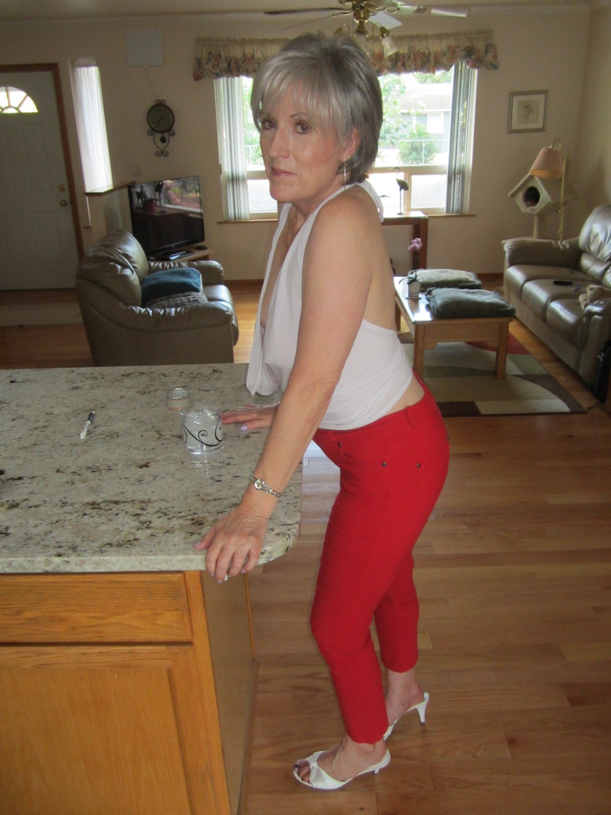 She look very hot sexy Granny ,In front of her lower stomach in middle between legs