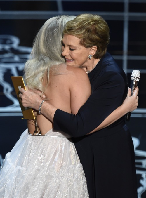 ladiessource: Julie Andrews hugs Lady Gaga on stage at the 87th Oscars February 22, 2015 in Hollywood, California.