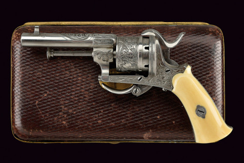 Cased, engraved, and ivory handled pinfire revolver originating from France, 19th century.