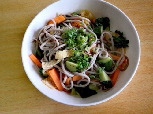 Soba Saladcucumbers, fried tofu, carrot, bok choy, topped with spring onions and chili pepper mix. d