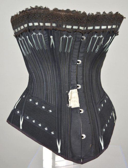 1890 Busk front corset typical of the beautifully designed styles of this period. Made with black la