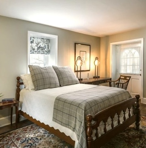 Traditional Bedroom - GuestExample Of A Mid-sized Classic Guest Ceramic Tile And Brown Floor Bedroom