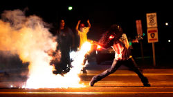 weneedboldstrokes:  2014- Ferguson, MO- Edward Crawford (Photo- Robert Cohen- St. Louis Post-Dispatch) 2015- Columbia, SC- Bree Newsome (Photo- Adam Anderson- Reuters) 2016- Baton Rouge, LA-   Ieshia Evans (Photo- Jonathan Bachman- Reuters) 