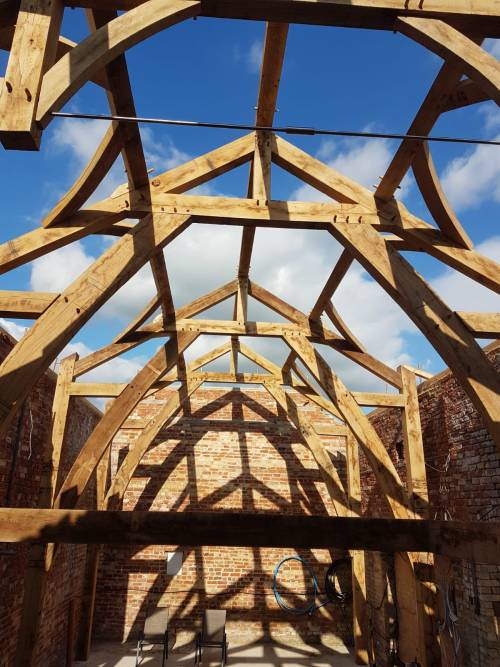 Sling brace truss timber frame design