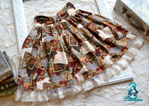  To the Library SkirtThis high-waist skirt is made with a rich book fabric with gold and ivory lac