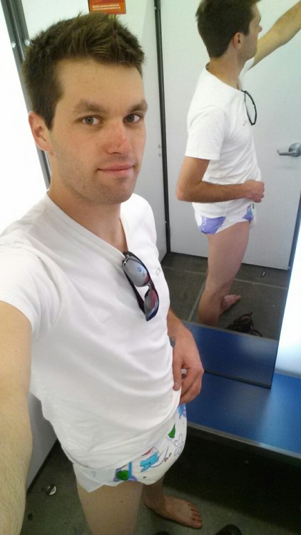 codydl88:  Shopping day. Salmon shorts! Yay!  Codydl88 is too damn cute! Sadly he only wets his pants while diapered, but I had to share his diapered dressing room pics because he is one very handsome diaper man. 