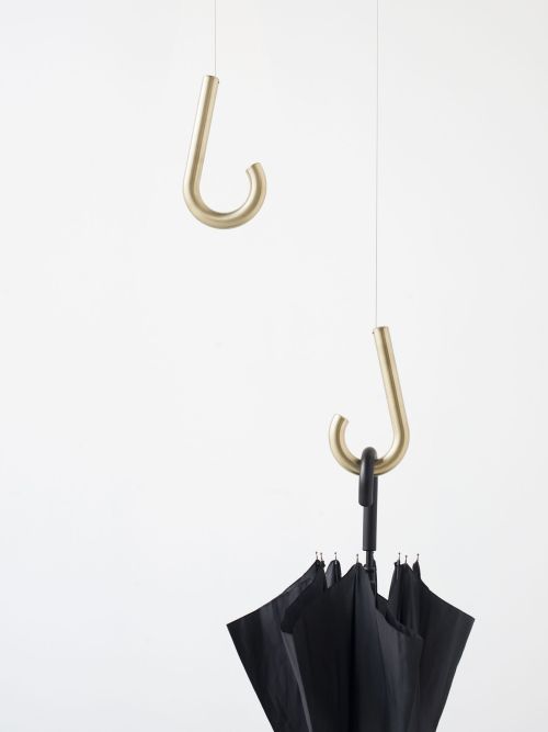 Welcome Home Hanger by Jean-François D’OrThis coat hanger gives the umbrella handle a new purpose an