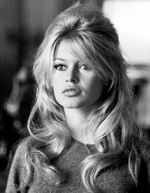 Brigitte Bardot at her most iconic—petulant pout, cat eyeliner and messy beehive—in the early 1960s.