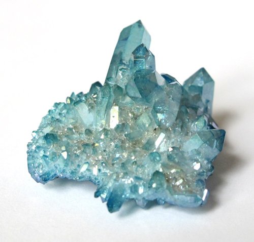 fuckyeahcrystals:Aqua aura quartz is formed when gold is fused with clear quartz, resulting in a permanent blue coloring. It helps protect and shield oneself from psychological and psychic attacks. It also activates and balances all chakras, especially