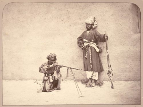Afghani tribesmen firing muskets, late 19th century.