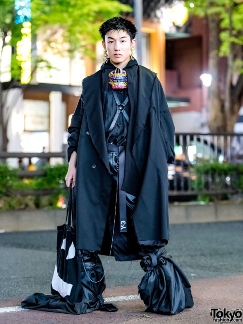 Japanese high school student Kanji on the street in Harajuku wearing a dark avant-garde look with ha
