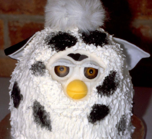 arcadefurbz:  turings:  turings: raw emotion captured through the medium of furby cakes   If u eat 1(one) frosting strand of his fur u will learn ALL the secrets of furby kind. 