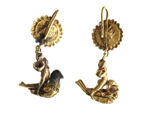 theancientwayoflife:~ Pair of earrings with Eros riding a dove. Place of origin: Greek Date: 299-200