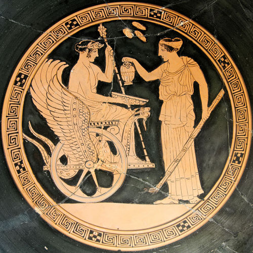 Kore (Persephone) gives the Eleusinian nobleman Triptolemos the gift of grain, which he will soon sp