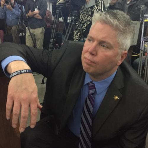 justice4mikebrown:January 28Jeff Roorda, Missouri State Representative and head of the STL Police Officers Association, wears “I Am Darren Wilson” bracelet and shoves woman during the #CivilianOversight/Public Safety Committee meeting. Livestreams